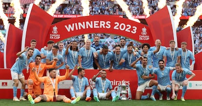 Manchester City players celebrate winning the English FA Cup final football match between Manchester City and Manchester United at Wembley stadium, in London, on June 3, 2023.