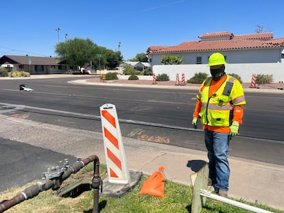 Christopher Nectsosie works on a highway in Phoenix, Arizona in 113-degree heat, on Thursday, July 20, 2023