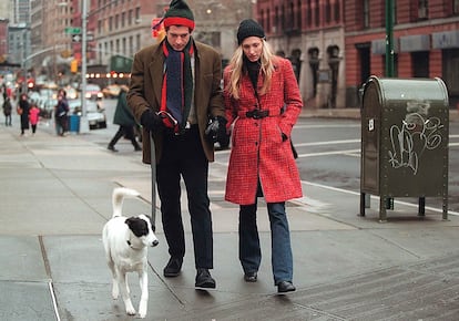 John-John Kennedy and his wife Carolyn Bessette-Kennedy walk with their dog, Friday.

