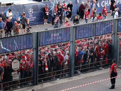 In this file photo taken on May 28, 2022 Liverpool fans stand outside unable to get in in time leading to the match being delayed prior to the UEFA Champions League final football match between Liverpool and Real Madrid at the Stade de France in Saint-Denis, north of Paris.