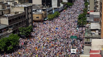 Thousands of people march on the streets of Caracas.