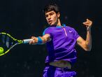 Spain's Carlos Alcaraz makes a forehand return to Botic van de Zandschulp of the Netherlands during their first round match at the Australian Open tennis championship in Melbourne, Australia, Tuesday, Feb. 9, 2021.(AP Photo/Hamish Blair)