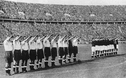 Players give a Nazi salute during a 1938 Germany v. England match at the Olympic Stadium in Berlin.