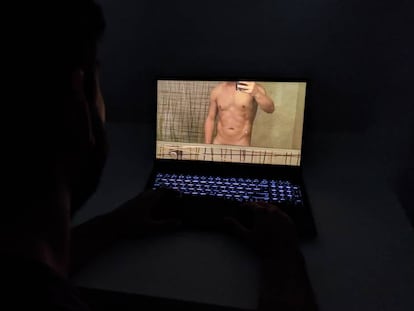 A user views a photograph of a naked man.