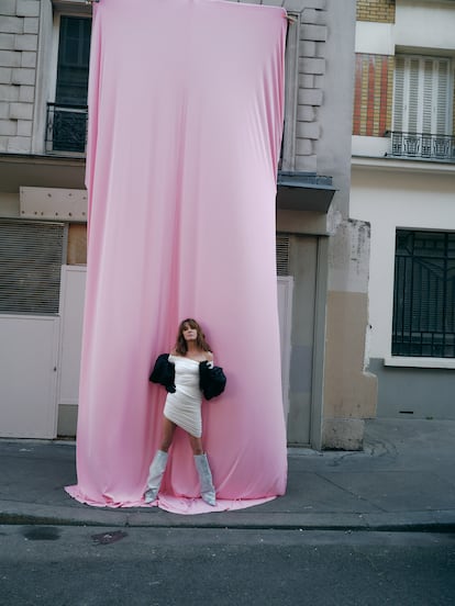 "Today [women] can get what we want without having to imitate men," says Leroy-Beaulieu. Here, she wears a Philosophy di Lorenzo Serafini stretch taffeta dress, AZ Factory stretch taffeta gloves, and Alexandre Vauthier Haute Couture denim booties.