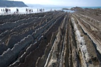 Swimmers near the "Flysch" of Zumaia