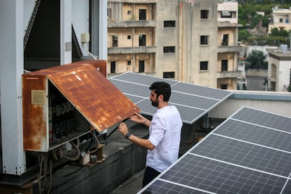 Elie Hachem, executive director of the Sainte-Thérèse hospital outside Beirut, checks the electrical installation on the roof.