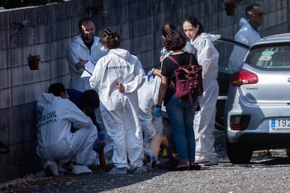 Civil Guard officers outside the house where the killings took place.