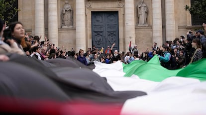 Youths take part in the occupation of a building of the Sciences Po University in Paris on April 26, 2024. 