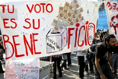 A poster at the 15-M protests. "Your vote is their profit," it reads.