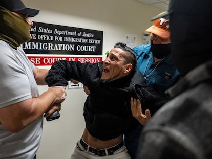 Federal agents arrest a man at an immigration court in New York on October 27.