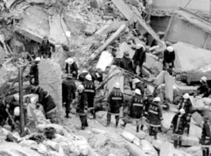 Firefighters look for survivors after the 1994 AMIA car bombing.