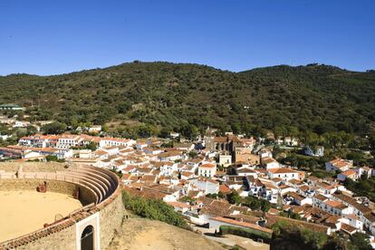 View of the bullfighting plaza and the village of Almonaster La Real, Huelva. This picturesque town features a castle-fortress with a mosque – both of which have been declared monuments of national interest, and a bullfighting ring built in the courtyard of the old fortress.