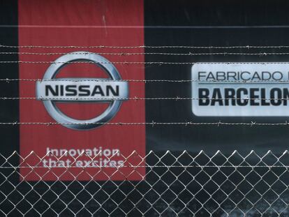 FILE PHOTO: The logo of Nissan is seen through a fence at Nissan's factory at Zona Franca in Barcelona, Spain, May 26, 2020. REUTERS/Albert Gea/File Photo