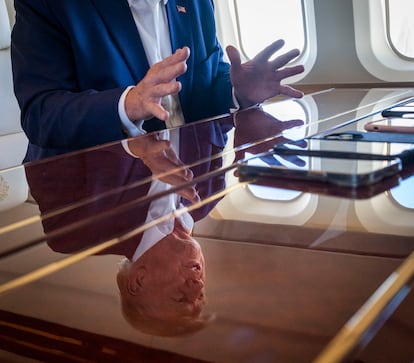 Donald Trump, photographed on his private plane, in June 2023. 

