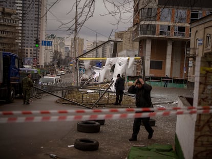 Police officers inspect area after an apparent Russian strike in Kyiv Ukraine, Thursday, Feb. 24, 2022.
