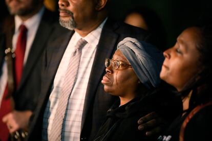 A tear runs down the cheek of Sheneen McClain as she is consoled by Omar Montgomery, president of the Aurora NAACP, outside the Adams County Colo., Justice Center, after a verdict was rendered in the killing of her son Elijah McClain, Friday, Dec. 22, 2023, in Brighton, Colo.