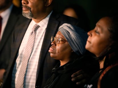 A tear runs down the cheek of Sheneen McClain as she is consoled by Omar Montgomery, president of the Aurora NAACP, outside the Adams County Colo., Justice Center, after a verdict was rendered in the killing of her son Elijah McClain, Friday, Dec. 22, 2023, in Brighton, Colo.