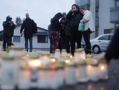 Relatives and acquaintances of the victims lay candles and flowers at the entrance of the Viertona school in Vantaa, in the Helsinki metropolitan area, on Tuesday.