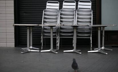 Chairs and tables outside a closed bar in Barcelona today.