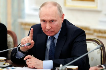 Russian President Vladimir Putin gestures as he speaks during a meeting with Russian war correspondents who cover a special military operation at the Kremlin in Moscow, Russia