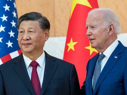 U.S. President Joe Biden, right, stands with Chinese President Xi Jinping before a meeting on the sidelines of the G20 summit meeting on Nov. 14, 2022.