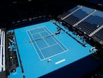 Germany's Alexander Zverev and Canada's Denis Shapovalov during their ATP Cup match in Melbourne, Australia, Wednesday, Feb. 3, 2021. The Australian Open site has the feel of a major this week with six tournaments being contested at Melbourne Park. Usually the tuneup tournaments Down Under are spread around the capital cities and some of the biggest stars have time off competitive play in the week before the first Grand Slam of the season. Not this year. The COVID-19 pandemic has changed the entire preparation for the Australian Open.(AP Photo/Hamish Blair)