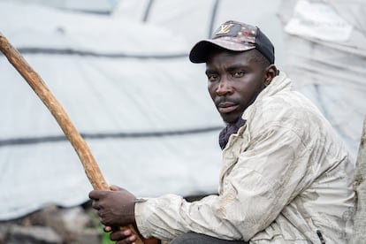 Vincent Ndahayo, father of six, poses in front of his tent. In his hometown he raised cows and made cheese, now he doesn't know what will become of him and his family. 