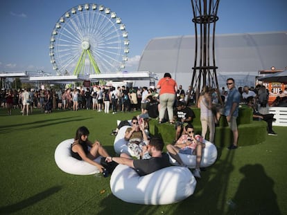A group of youngsters wait for a concert to begin at the Mad Cool Festival in Madrid.