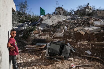 A Hamas flag flies last Tuesday over the remains of the house of Hamas deputy leader Saleh al-Aruri, which was demolished by the Israeli army.