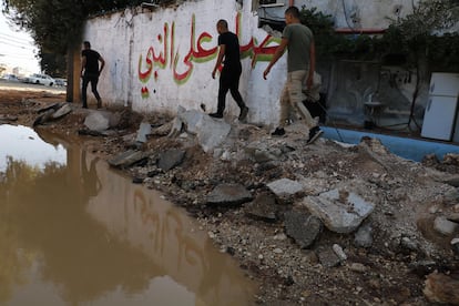 A street in the refugee camp with asphalt lifted by a bulldozer during an Israeli military operation.