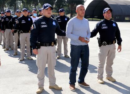 In this photo provided by the Colombian Police press office, police escort Álvaro Córdoba during his extradition to the U.S., Jan. 19, 2023, in Bogota, Colombia.