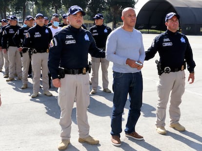 In this photo provided by the Colombian Police press office, police escort Álvaro Córdoba during his extradition to the U.S., Jan. 19, 2023, in Bogota, Colombia.