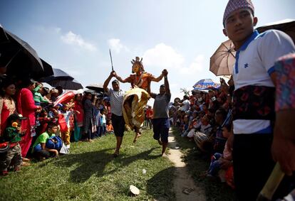 A medium dressed as a deity jumps during a trance while celebrating Shikali festival at Khokana village in Lalitpur, Nepal October 7, 2016. REUTERS/Navesh Chitrakar