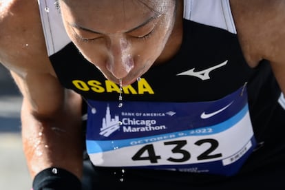 Hiroki Nakajimi cools himself off with water after completing the Chicago Marathon, Sunday, Oct. 9, 2022.