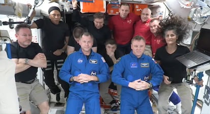 Nick Haig and Alexander Gorbunov (in blue, center) during the welcoming ceremony upon arrival at the ISS.