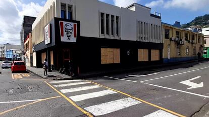 A KFC restaurant is boarded up with plywood ahead of the arrival of Hurricane Beryl in Kingstown, St. Vincent and the Grenadines June 30, 2024 in a still image from video.