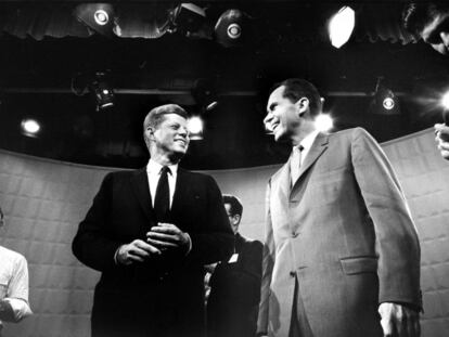Richard Nixon (right) and John F. Kennedy, smiling moments before the start of the first televised election debate in history, in September 1960.