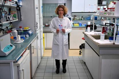 Solange Desagher, a married with two children 47-year-old researcher on cell biology at a state-funded facility poses with her voting card at her lab on February 21, 2017 in Montpellier in southern France.
What should be the priorities of the next French president?
"The next president should draw on the expertise of French scientists in a number of areas when making decisions about the country. He or she should give researchers the resources to work, not necessarily by increasing research budgets but by better distributing available funding. The president should also support basic research, which can lead to big discoveries, by providing more funding for long-term programmes and commissioning fewer short-term projects. It is also important to support young scientists, by turning ad hoc contracts into permanent jobs in universities and research facilities, and employing them in senior civil service roles and in business." / AFP PHOTO / PASCAL GUYOT / RESTRICTED TO EDITORIAL USE - RESTRICTED TO FRENCH ELECTIONS ILLUSTRATION PURPOSE