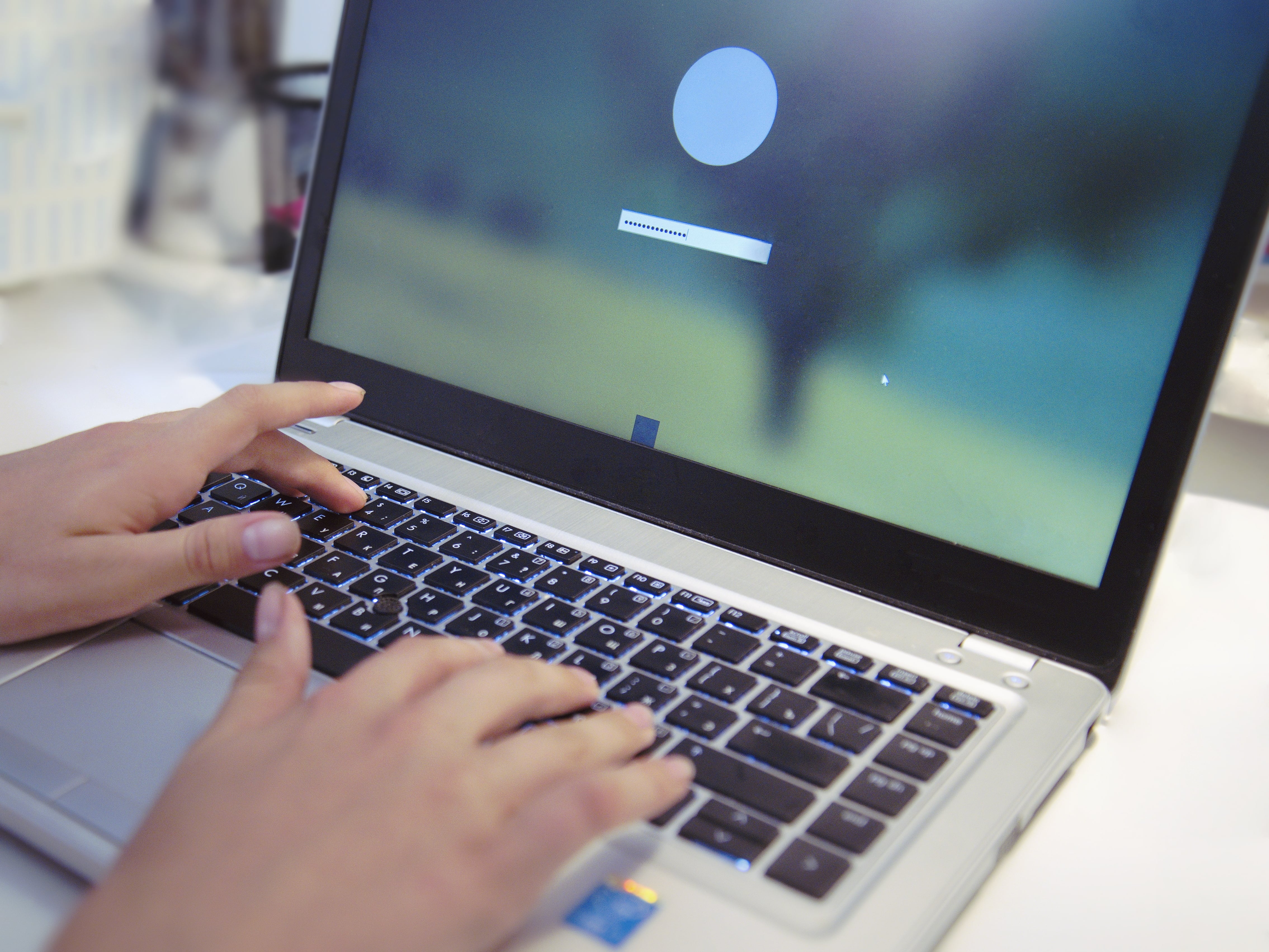 On the laptop screen, enter the password to log in to the operating system.