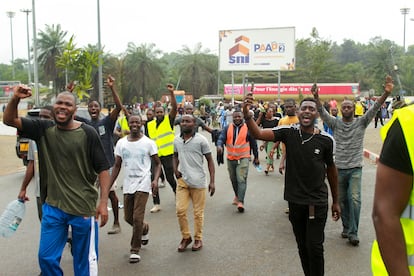 People celebrate in support of the coup in a street of Libreville, Gabon