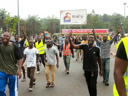 People celebrate in support of the coup in a street of Libreville, Gabon