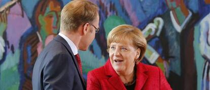 La canciller alemana habla con el presidente del Bundesbank, Jens Weidmann