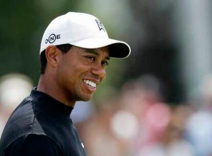 Tiger Woods, sonriente durante las prácticas de ayer.