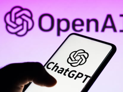 In this photo illustration, the ChatGPT logo is seen displayed on a smartphone and the OpenAI company logo on background