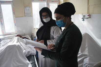 Malalai Rahim Faizi (2nd R) visits a patient at the Malalai Zizhanton Hospital in Kabul, Afghanistan, on Feb. 8, 2022