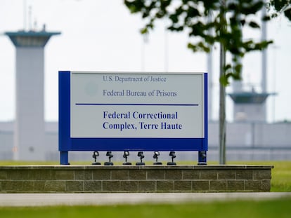 A sign is displayed at the federal prison complex in Terre Haute, Ind., on Aug. 28, 2020.