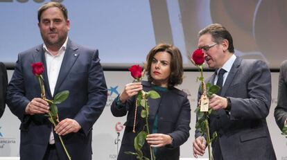 Oriol Junqueras, Sáenz de Santamaría i Jaume Giro, durant l'acte de presentació de la candidatura de Sant Jordi per a la Unesco.