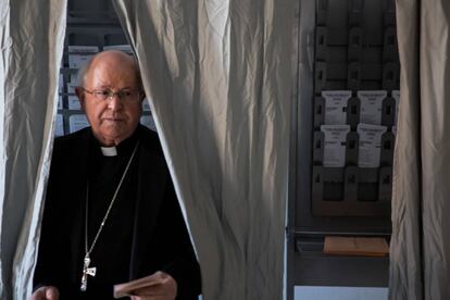 The bishop of Santiago, Julian Barrio, emerges from a voting booth. At 2pm, voter turnout was 41.34%, 4.5 points up from 2016.