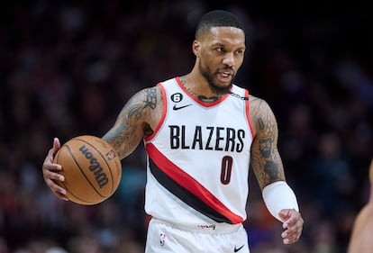 Portland Trail Blazers guard Damian Lillard brings the ball up against the New York Knicks during the second half of an NBA basketball game in Portland, Ore., Tuesday, March 14, 2023.